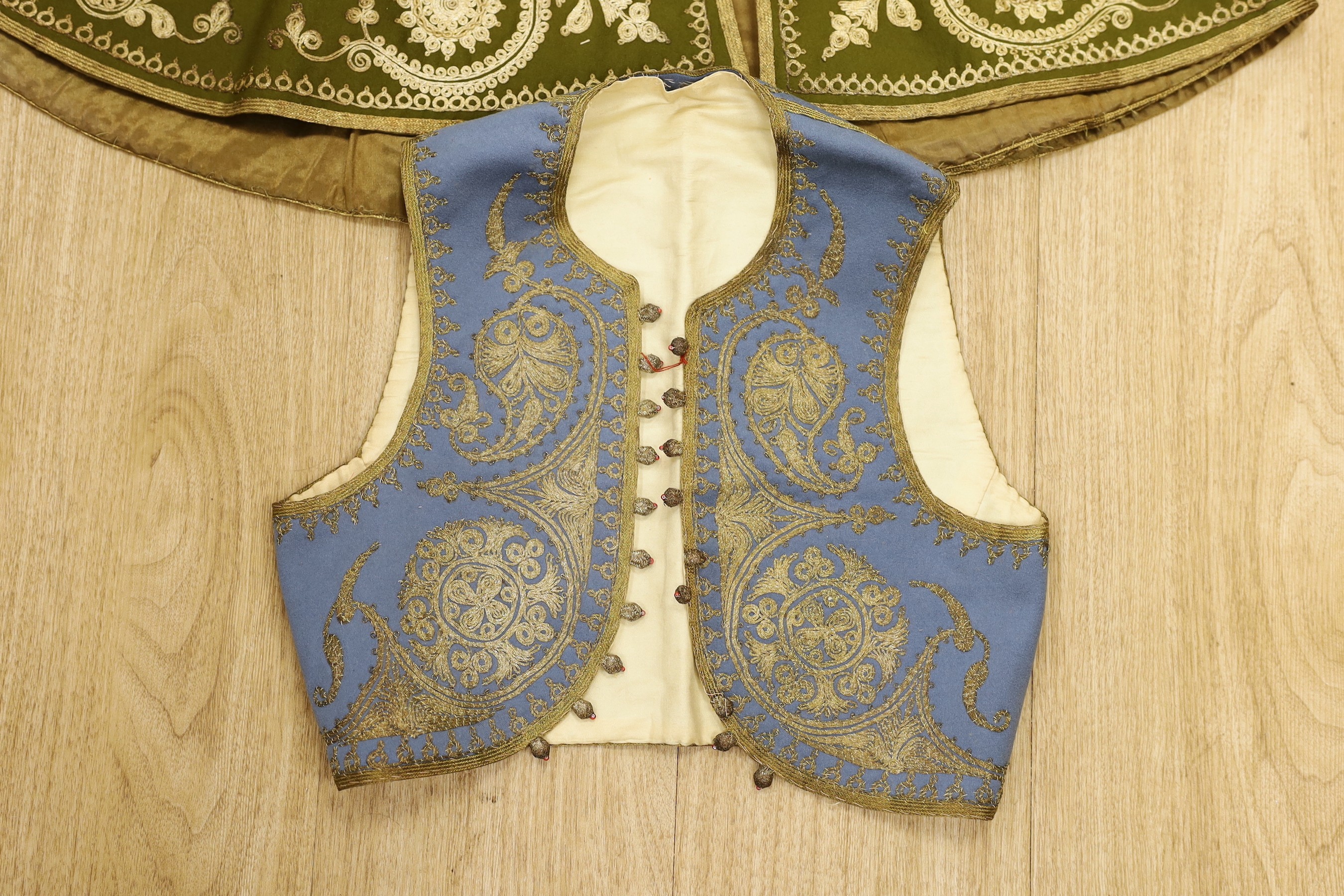 A Victorian child's waistcoat and cloak